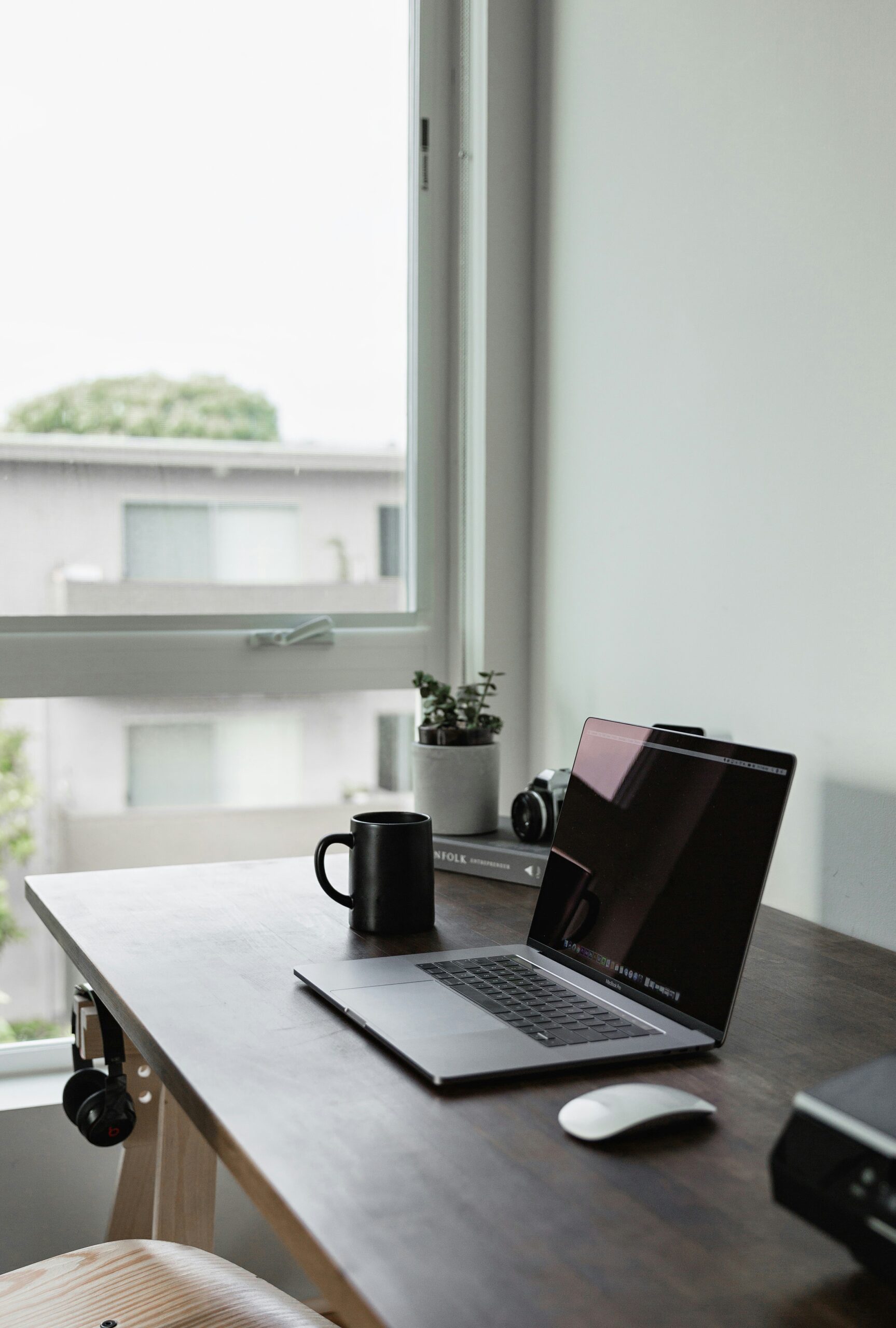 A laptop on a desk - LexicMinds Directory